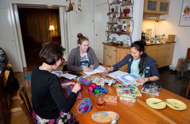 Au pair at table with family