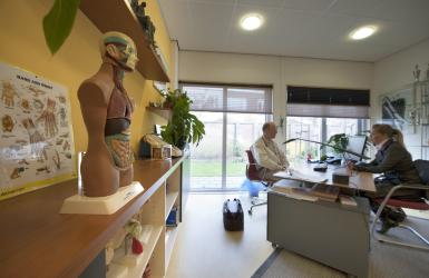 Physician and patient in consultation room